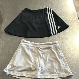 Two girls tennis skirts, both good condition